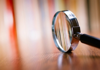 magnifying glass review report scrutiny look investigation