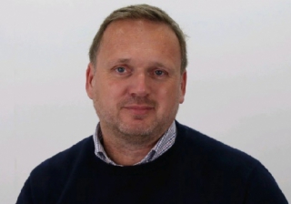 Jonathan Barrett, CEO of Comentis