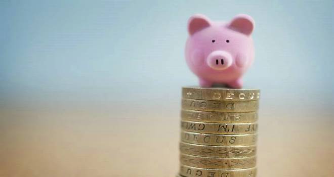 pig saving coins stack save isa bond
