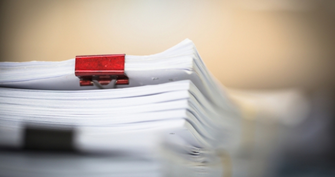 legal paperwork with binder clips